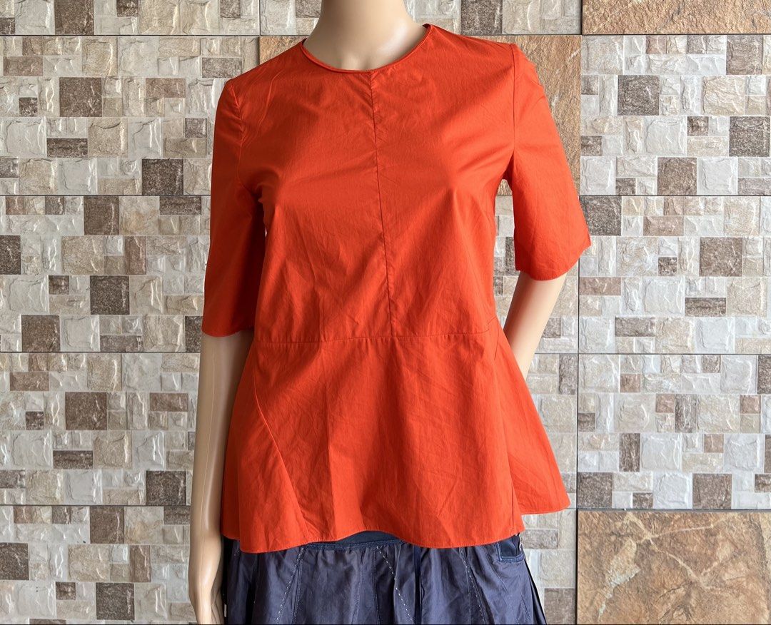 MARNI - “ VIBRANT CONSTRUCTED “ TOP (Category: Blouses) located in Bacolod City. Submitted by timelessbyjosh (Listing ID 1470001837, Image 1). Description: BEST FOR CASUAL & FORMAL OUTFITS SIZE : 40 ACTUAL COLOR : LIGHT ORANGE COLOR RATE : 10 OUT OF 10 CONDITION : NEAR NEW MATERIAL : 100 % COTTON MADE IN : PORTUGAL FLAWS : NONE DIMENSIONS LENGTH - 24 ( FRONT ) & 26 ( BACK ) WIDTH - 17 MEASUREMENT TAKEN WHILE LAYING FLAT. PLEASE COMPARE THE MEASUR