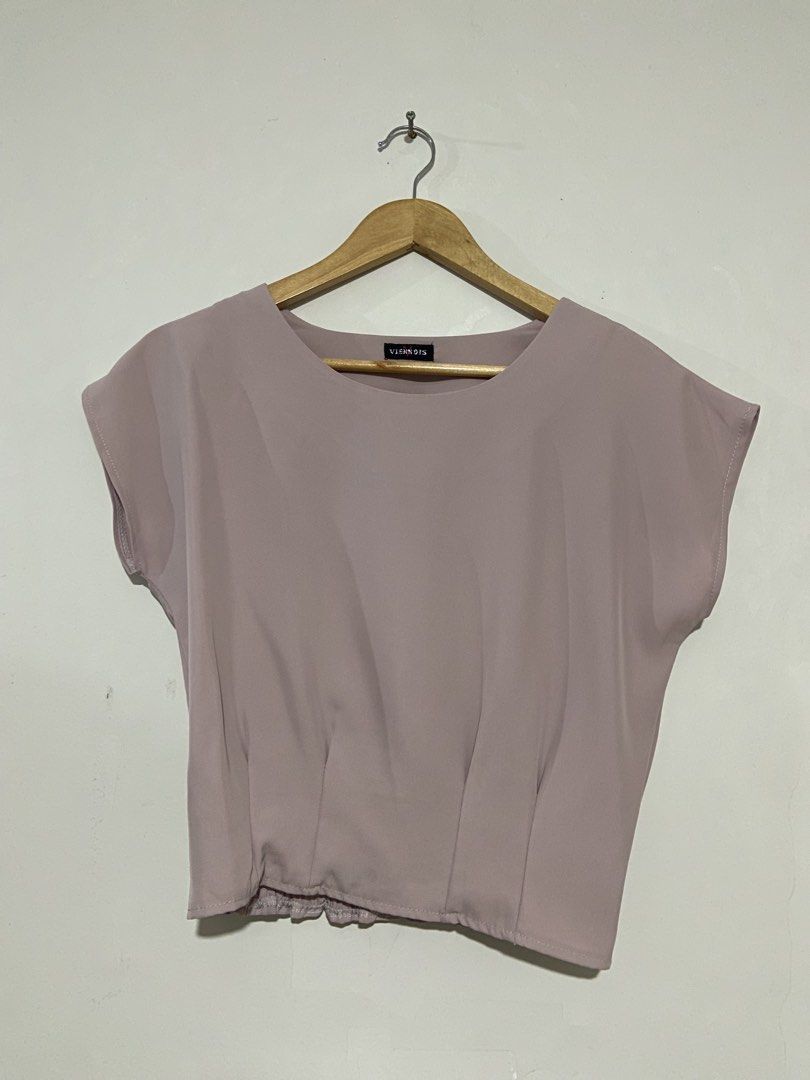 Mauve pink casual top (Category: Blouses) located in Lapu-Lapu City. Submitted by denyella (Listing ID 1469965574, Image 1). Description: Mauve Pink Sleeveless Top • Soft dusty mauve pink color • Cap sleeve design • Round neckline • Pleated front detail • Smocked waist with a ruffled hem used once size: S-M perfect for both casual and corporate fits! .