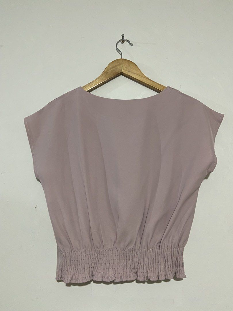 Mauve pink casual top (Category: Blouses) located in Lapu-Lapu City. Submitted by denyella (Listing ID 1469965574, Image 2). Description: Mauve Pink Sleeveless Top • Soft dusty mauve pink color • Cap sleeve design • Round neckline • Pleated front detail • Smocked waist with a ruffled hem used once size: S-M perfect for both casual and corporate fits! .