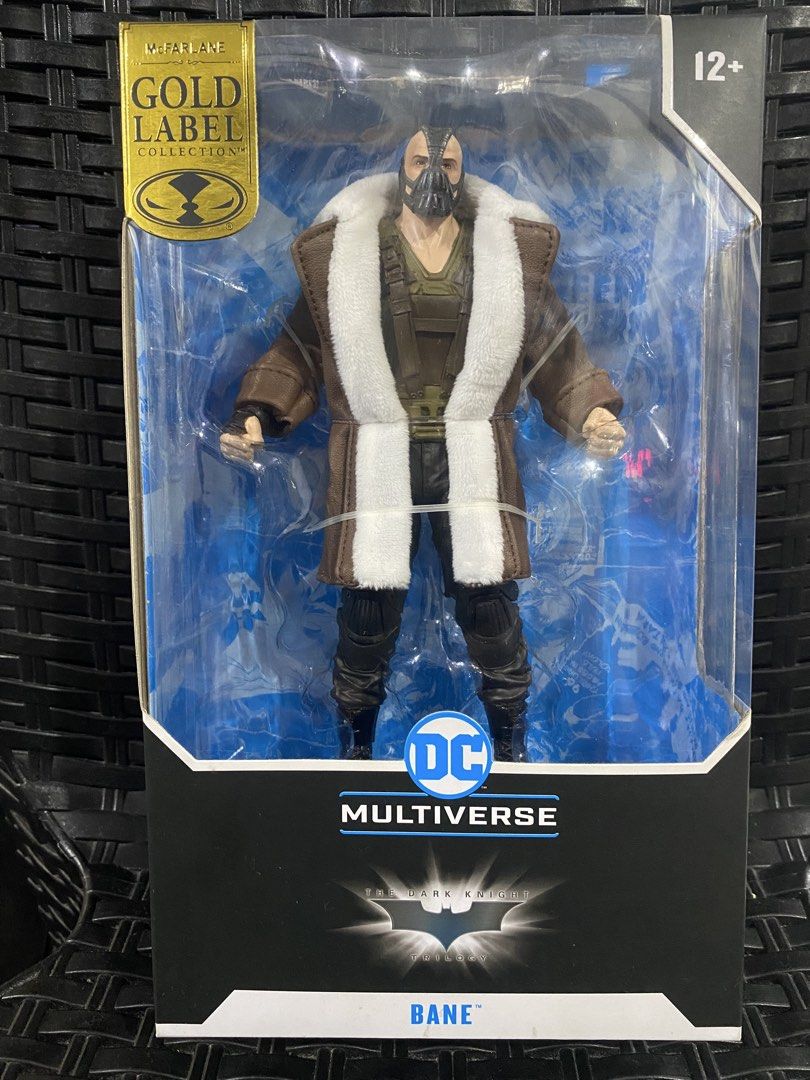 McFarlane DC Multiverse Bane The Dark Knight Trilogy Action Figure (Category: Figurines & Statues) located in Angeles City. Submitted by carrlarcollectibles (Listing ID 1469959122, Image 1). Description: - Official DC Multiverse McFarlane Gold Label Collection Bane figure - From The Dark Knight Trilogy - Features his iconic brown coat with white faux-fur lining and harness - Brand new and unopened box with a clean plastic window. What you see is 