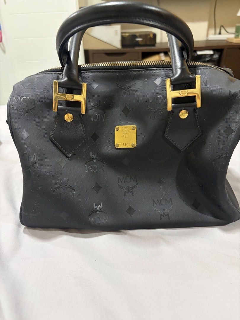 MCM boston bag nylon (Category: Luxury Bags & Wallets) located in Makati City. Submitted by rnathaliem (Listing ID 1469979764, Image 1). Description: MCM boston bag nylon Color : black MCM Nylon Monogram Boston Bag in black with gold-tone hardware and rolled top handles Best bag for traveling, lightweight and can fit many items inside.