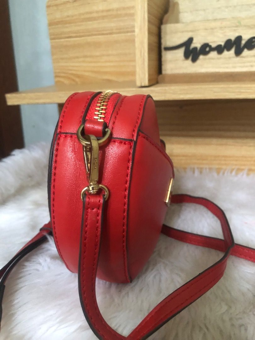 Mcm Limited edition Chicken Heart Shaped Small Bag (Category: Cross-body Bags) located in Lucena. Submitted by gracious_chin0436 (Listing ID 1469949351, Image 3). Description: - Fun red heart-shaped rooster/chicken novelty crossbody bag - Features sparkling red crystals and edgy gold-tone studs on the front - Secure gold zip-top closure and durable gold hardware - Practical back pocket complete with a gold metal brand plate - Long, adjustable mat