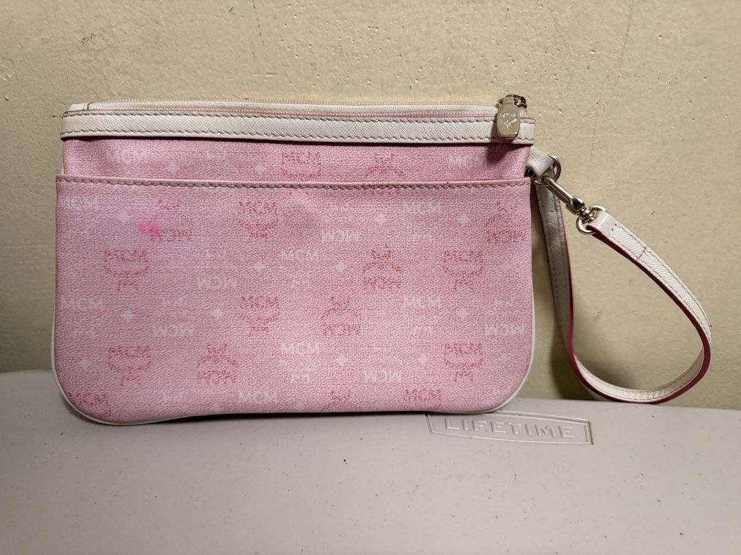 MCM Wristlet (Category: Wallets & Card holders) located in Batangas. Submitted by stopandshopforluxury (Listing ID 1470052305, Image 2). Description: GUARANTEED ORIGINAL **kasama 'to sa tote bag ko pero eto lang ibebenta ko for now. No issue and fixed.