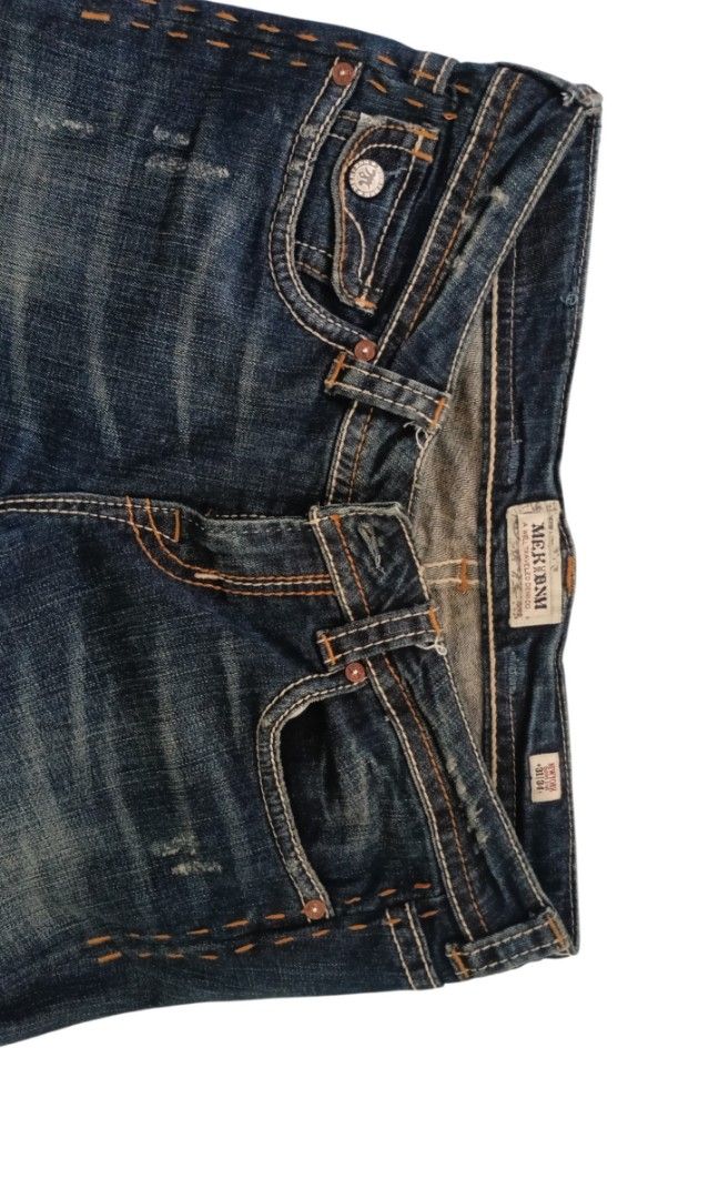 MEK DENIM (Category: Activewear) located in Manila. Submitted by biniyayaan (Listing ID 1469961896, Image 3). Description: MEK DNM dark wash distressed denim jeans featuring contrast orange stitching and front coin/hip pocket detailing..