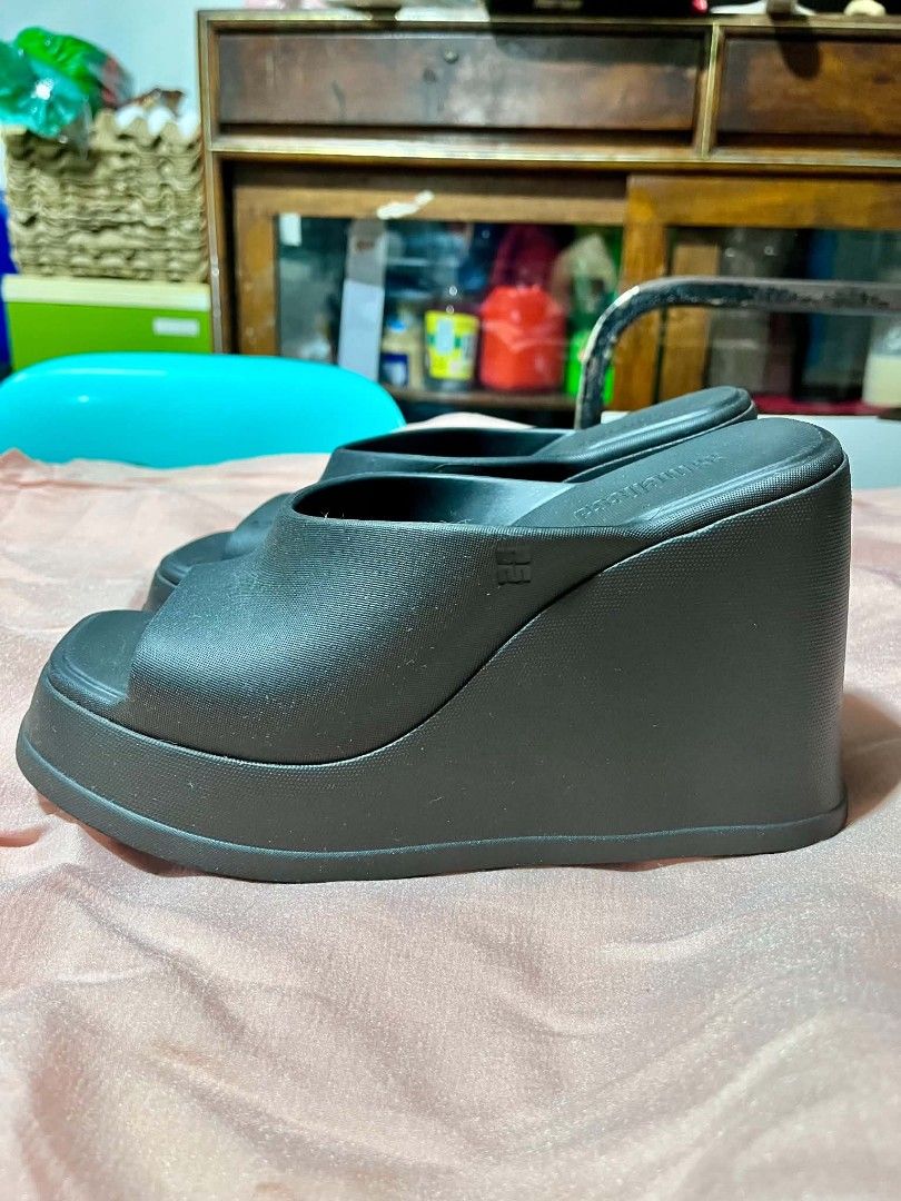 Melissa Black Platform Wedge Mules Slides (Category: Wedges) located in Quezon City. Submitted by luigiposerio2 (Listing ID 1470081428, Image 3). Description: - Brand: Melissa - Style: Platform wedge slides with open toe and chunky block heel - Aesthetic: Y2K chunky look - Size: US 7 / EUR 38 / BR 36 - Material: Signature scented (bubblegum scent) Melflex plastic, 100% vegan - Origin: Made in Brazil - Condition: Minor dust accumulation from stora