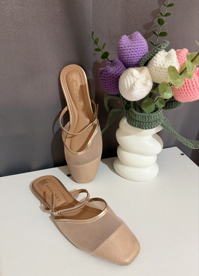 Mendrez Gold Mesh Flats Sandals (Category: Flats & Sandals) located in Manila. Submitted by feypasabuyph (Listing ID 1469966899, Image 1). Description: - Brand: Mendrez - Color: Versatile neutral gold metallic - Design: Mesh front panel with dual thin straps and tiny buckle detail - Style: Easy slip-on flats for effortless wear - Condition: Clean insoles with clear brand logo stamp.