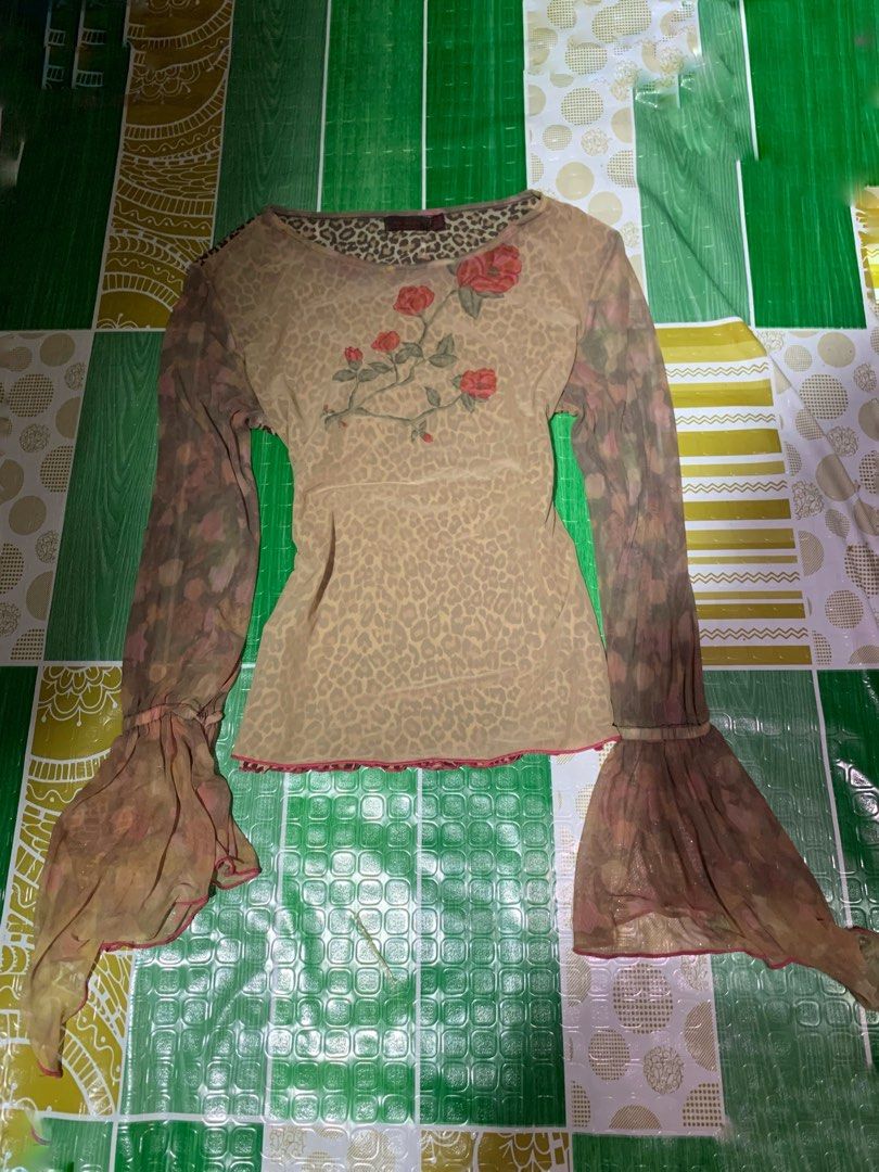 Mesh leopard print rose graphic long sleeve top (Category: Longsleeves) located in Cebu City. Submitted by selamethrift (Listing ID 1470062007, Image 1). Description: - Trendy sheer mesh top with leopard print and rose branch chest graphic - Long bell sleeves with cute ruffled edges and pink hem trim - Unique leopard print detail inside the collar - Lightweight, stretchable fabric for comfortable wear - Condition: Brand new / Excellent (Ready to 