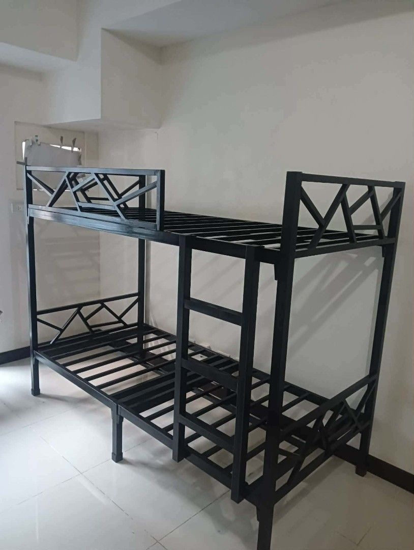 Metal Double Bed Heavy Duty Frame (Category: Bed Frames & Mattresses) located in Manila. Submitted by joydejuan22 (Listing ID 1470020058, Image 2). Description: - Color: Sleek black - Material: Sturdy metal frame with side ladder - Support: Slatted base included (no box springs needed) - Ideal For: Shared bedrooms, dorms, or guest rooms - Convenience: Easily disassembles for convenient transport.