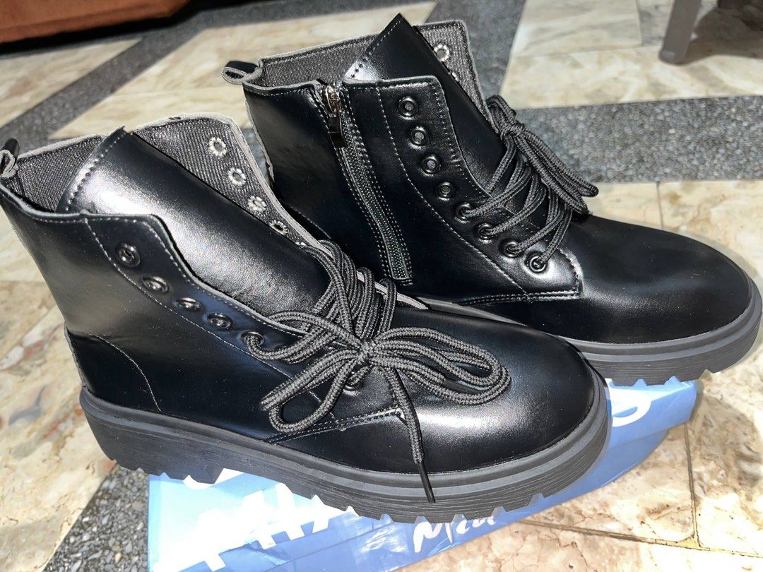 Mia Shoes Black Combat Boots (Category: Boots) located in Manila. Submitted by charlotte.mae (Listing ID 1469992648, Image 3). Description: - Brand: Mia Shoes - Style: Black combat boots with chunky lug soles - Size: 250 (marked on the bottom) - Design: Round toes, lace-up front, and convenient side zippers for easy on/off - Inclusions: Original box included - Condition: Excellent, ready to ship.