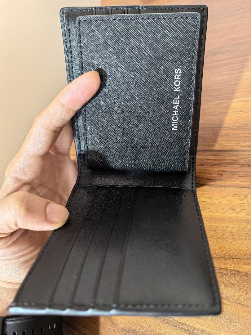 Michael Kors Cooper Men Black Billfold Wallet & Passcase Bifold (Category: Wallets & Card Holders) located in Manila. Submitted by anikar20 (Listing ID 1469949844, Image 2). Description: 🖤 MICHAEL KORS (MK) MEN'S COOPER BLACK WALLET 🖤 Selling Michael Kors Men's Cooper Black Wallet, bought in the USA 🇺🇸 ✨ Condition: Good as new — never used ✔️ Guaranteed original ✔️ Bought in the USA ✔️ Classic black design — stylish and timeless ✔️ No box inc
