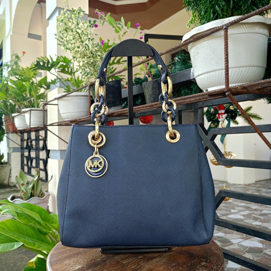 Michael Kors Navyblue handbag (Category: Shoulder Bags) located in Barugo. Submitted by green.trendsetter (Listing ID 1470140746, Image 1). Description: PRELOVED MEANS PRELOVED. Each piece has been previously loved and may naturally have signs of use such as creasing, scratches, stains, discoloration, or other imperfections. Kindly manage your expectations accordingly. •We kindly ask for no fussy buyers. • Photos of bag’s details and other identi