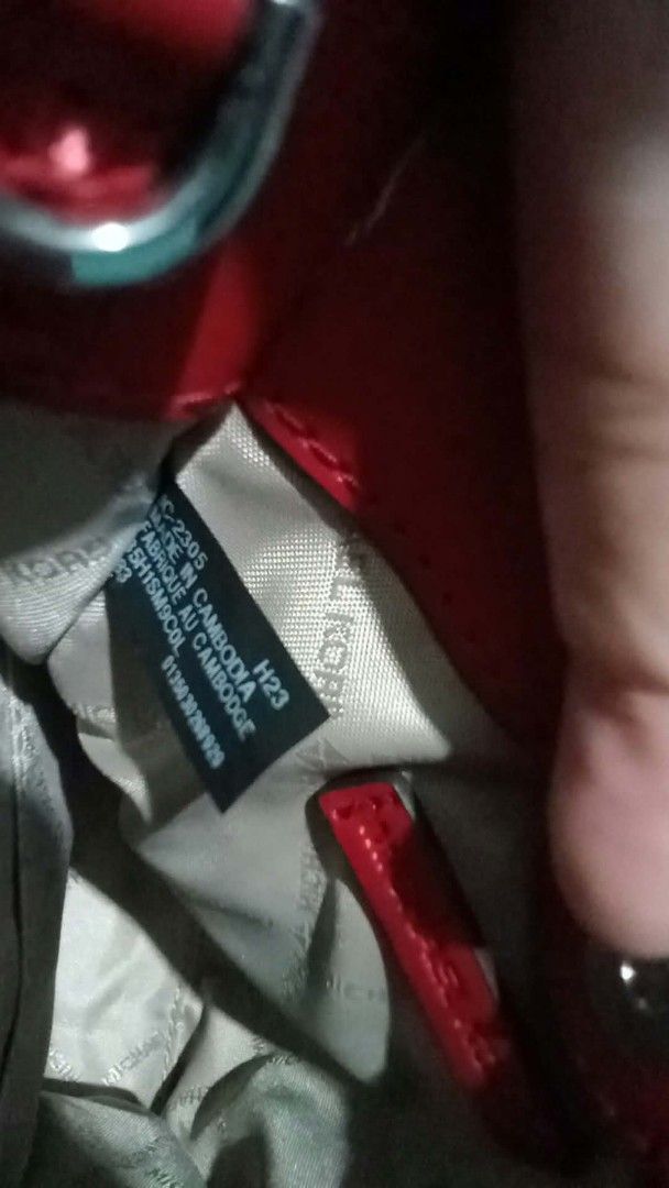 Michael Kors Red Mini Tote Bag (Category: Tote Bags) located in Caloocan City. Submitted by joice2024 (Listing ID 1470028055, Image 3). Description: NEGOTIABLE - Authentic Michael Kors mini tote bag in vibrant red pebbled leather - Chic silver-tone hardware with matching MK circle charm - Structured twin top handles for easy carrying - Clean light-colored logo fabric lining with style/origin tag inside - Compact and stylish size, ideal for your e