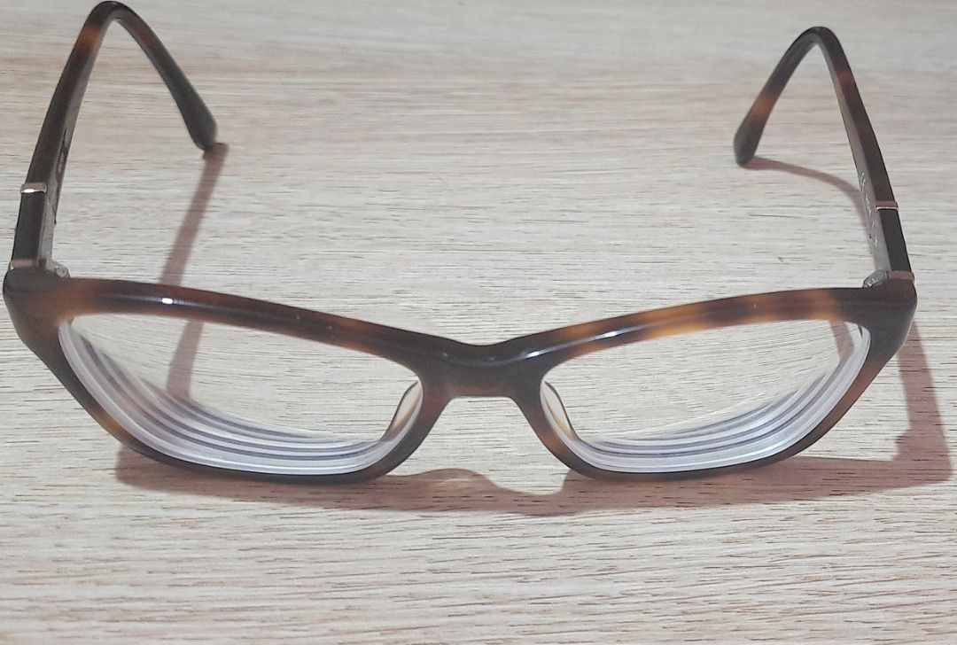 Michael Kors Tortoiseshell Eyeglasses Frame with Case (Category: Sunglasses & Eyewear) located in Manila. Submitted by crejzshoppe (Listing ID 1469997083, Image 3). Description: - Brand: Michael Kors - Style: Classic cat-eye frame in tortoiseshell - Size: 51-16-135 (temple arm measurements) - Details: Signature gold MK logo plaque on both temples - Inclusions: Original brown leatherette Michael Kors hard case - Lenses: Replaceable - In very good 