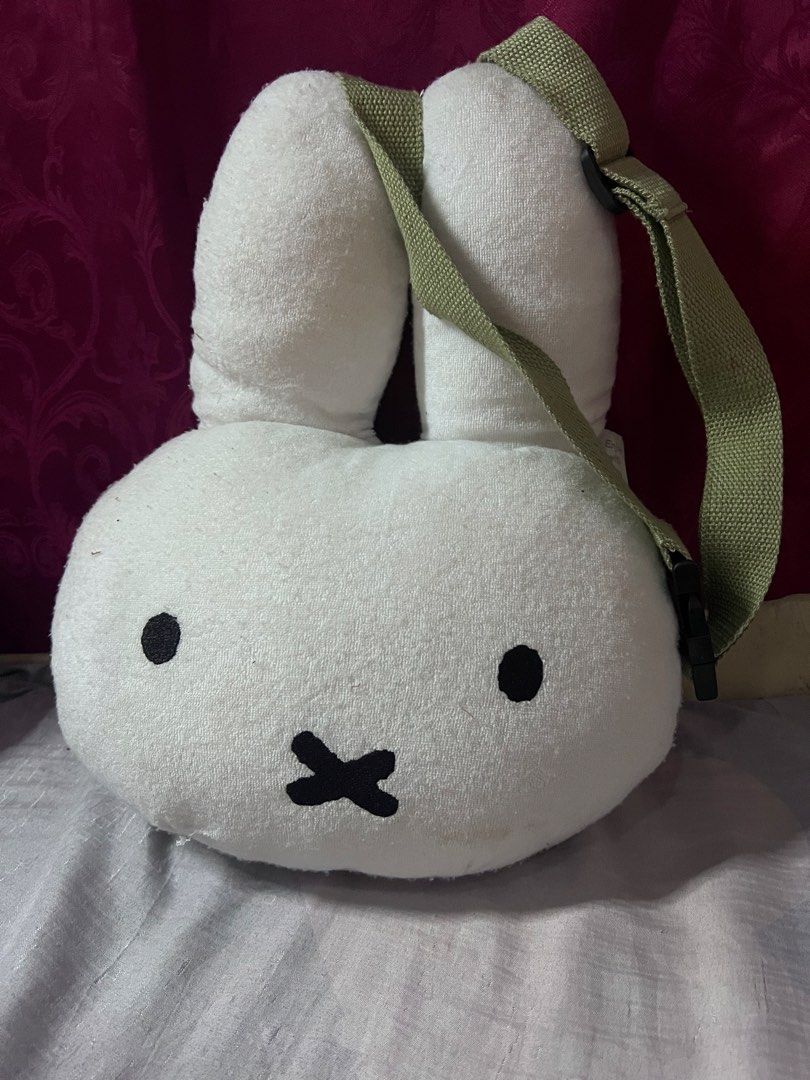 Miffy plush face crossbody bag white (Category: Cross-body Bags) located in Bulacan. Submitted by haven_plushie_dolls.888 (Listing ID 1470103963, Image 1). Description: - Authentic Miffy plush face crossbody bag - Soft towel-like fabric material in clean condition - Adjustable green canvas strap with buckle closure - Features 'Enjoy with Bruna' and Mercis bv tag - Perfect cute accessory for daily use or casual outings - need wash.