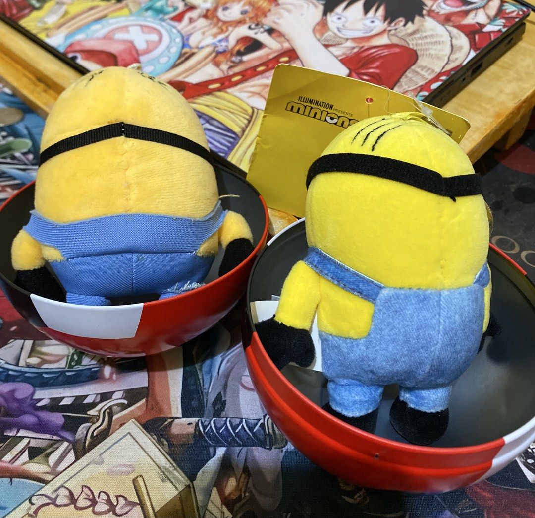 Minions Plush Toy Set with Tin Containers (Category: Plushies & Soft Toys) located in Baguio. Submitted by thrift_bonita (Listing ID 1470034212, Image 3). Description: - Set of 2 adorable Minions plush toys - Comes in unique round tin containers - Features two expressions: tongue sticking out (with tag) and big laughing mouth - Made with soft fabric material and detailed embroidery - Fun and collectible set, perfect for Minions fans.