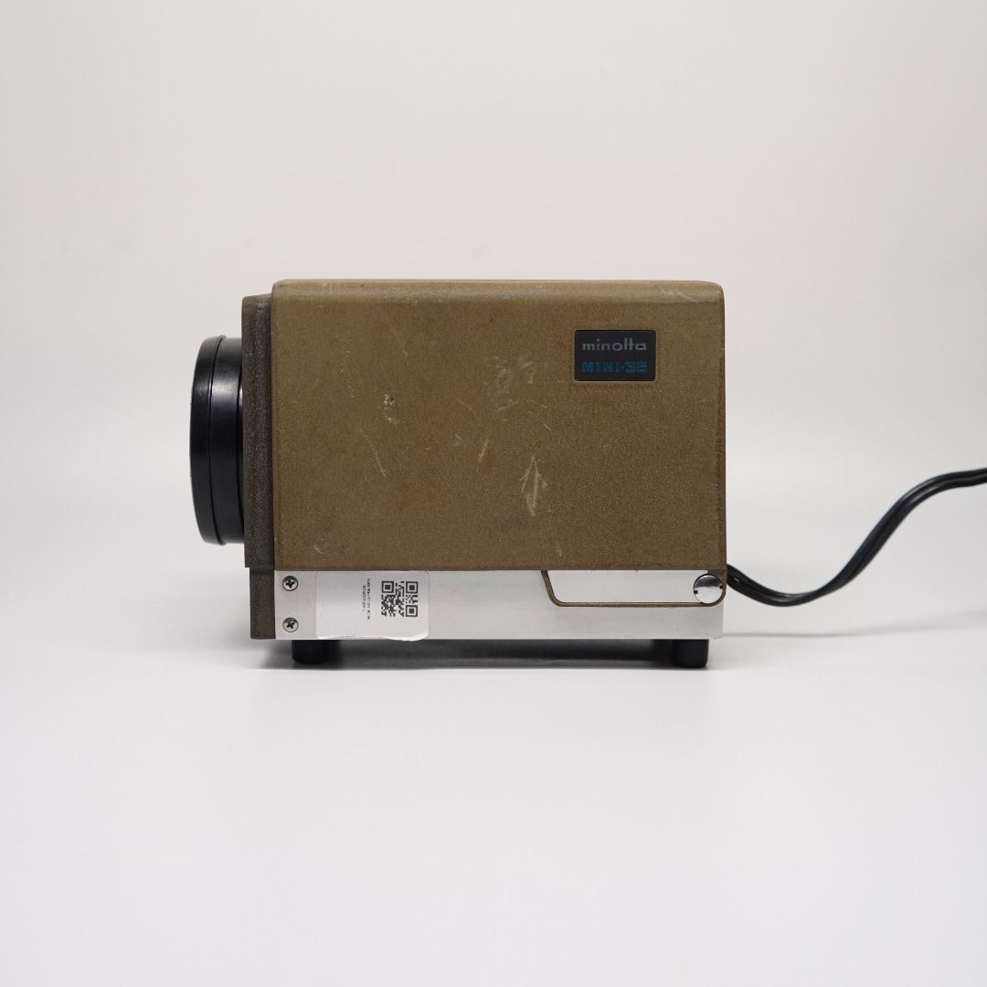MINOLTA MINI-35 — 35MM SLIDE PROJECTOR (Category: Projectors) located in Las Pinas. Submitted by retrocameraph (Listing ID 1470106240, Image 3). Description: 📽️ MINOLTA MINI-35 — 35MM SLIDE PROJECTOR A vintage Minolta waiting for its next chapter! ✨ • P-Rokkor 75mm f/2.5 projection lens • Clean lens and presentable overall condition • Great for display, collecting, or future restoration ⚠️ Bulb is busted and needs replacement. Projection functio