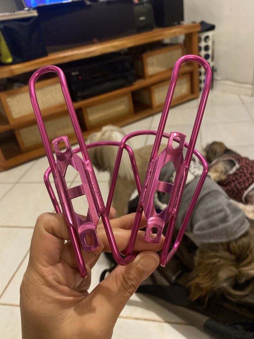 Minoura Pink Bicycle Water Bottle Cages Pair (Category: Bicycles) located in Muntinlupa City. Submitted by ahermosa (Listing ID 1470077079, Image 2). Description: - Set of 2 Minoura water bottle cages - Eye-catching bright metallic pink finish - Lightweight wire design securely holds standard water bottles - Includes mounting brackets for easy installation - Perfect way to add a vibrant pop of color to your bike setup - New and never used - Origi
