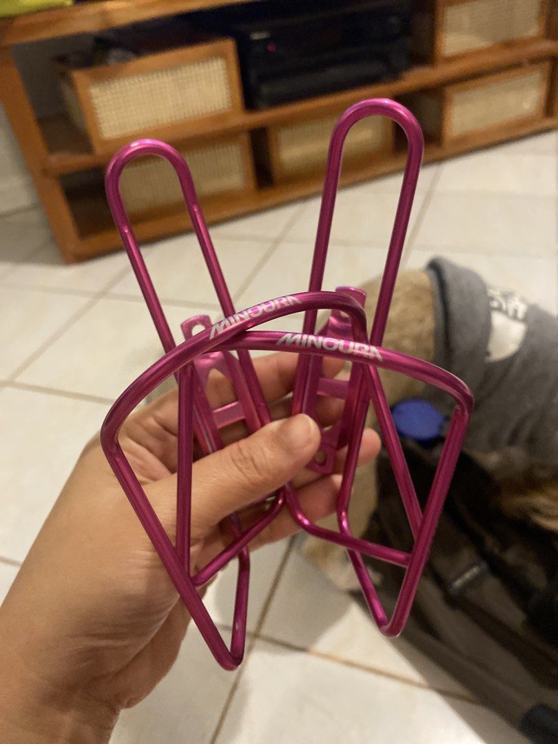 Minoura Pink Bicycle Water Bottle Cages Pair (Category: Bicycles) located in Muntinlupa City. Submitted by ahermosa (Listing ID 1470077079, Image 1). Description: - Set of 2 Minoura water bottle cages - Eye-catching bright metallic pink finish - Lightweight wire design securely holds standard water bottles - Includes mounting brackets for easy installation - Perfect way to add a vibrant pop of color to your bike setup - New and never used - Origi