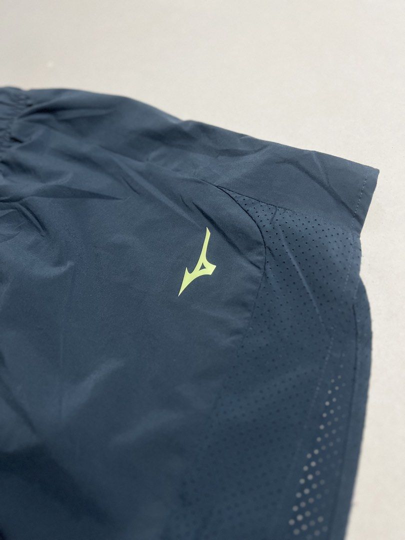 Mizuno Men's Running Shorts Dark Grey Small (Category: Shorts) located in Tacloban City. Submitted by thrftg (Listing ID 1470086216, Image 2). Description: - Brand: Mizuno - Item: Men's Running Shorts - Color: Dark Grey with Neon Yellow Logo - Size: Small (S) - Condition: Brand New / Excellent - Features: Built-in liner, elastic waistband with branded drawstring, and perforated side panels for ventilation - Origin: Made in Thailand - Style Code: 