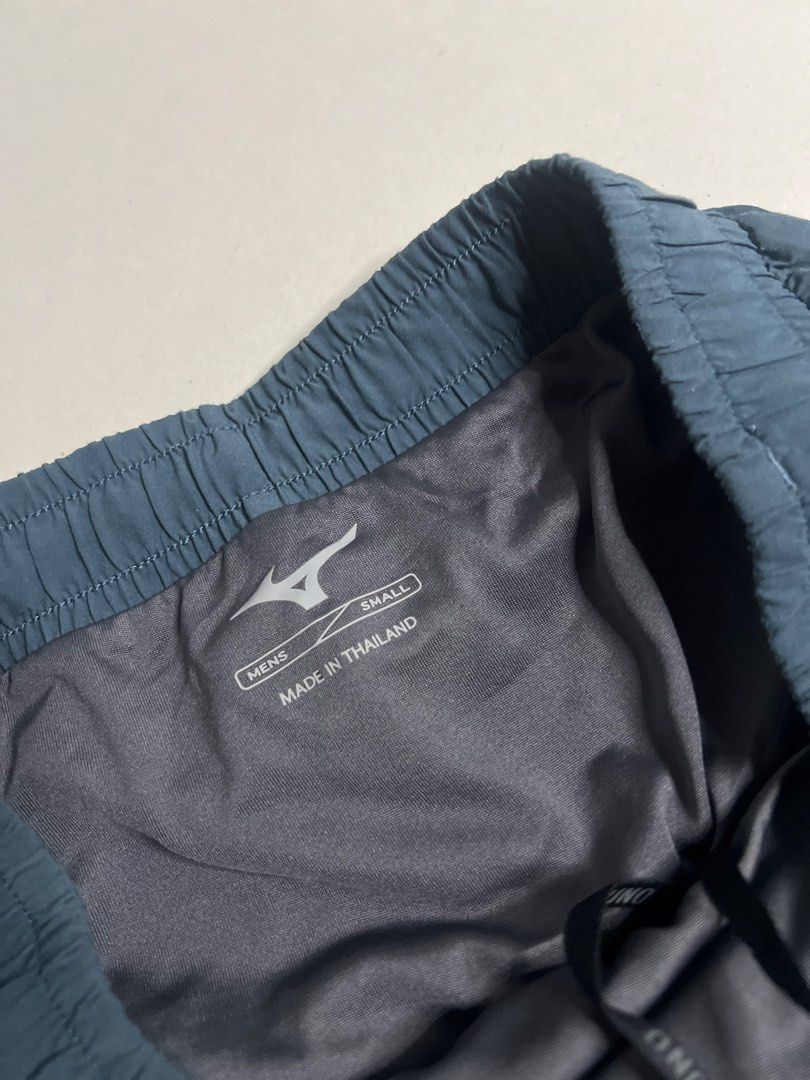 Mizuno Men's Running Shorts Dark Grey Small (Category: Shorts) located in Tacloban City. Submitted by thrftg (Listing ID 1470086216, Image 3). Description: - Brand: Mizuno - Item: Men's Running Shorts - Color: Dark Grey with Neon Yellow Logo - Size: Small (S) - Condition: Brand New / Excellent - Features: Built-in liner, elastic waistband with branded drawstring, and perforated side panels for ventilation - Origin: Made in Thailand - Style Code: 