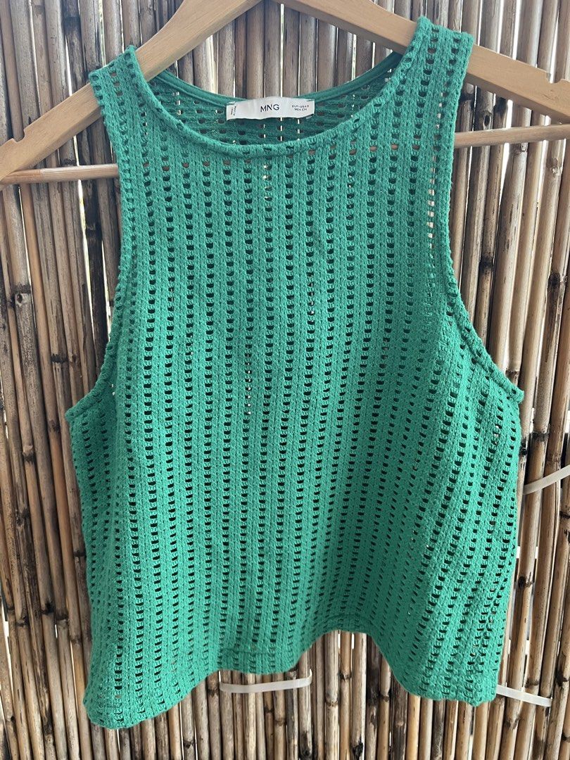 MNG Green Knit Sleeveless Top (Category: Sleeveless) located in Taguig. Submitted by bestthriftxx (Listing ID 1470011710, Image 1). Description: - Brand: MNG - Size: S - Color: Bright green - Style: Sleeveless knit top with round neckline - Material: Breathable open-weave pattern - Fit: Relaxed fit - Condition: Clean inside and out, ready to wear - Perfect for: Warm weather layering and pairing with high-waisted denim.