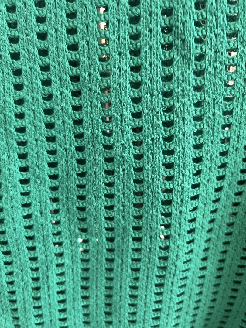 MNG Green Knit Sleeveless Top (Category: Sleeveless) located in Taguig. Submitted by bestthriftxx (Listing ID 1470011710, Image 3). Description: - Brand: MNG - Size: S - Color: Bright green - Style: Sleeveless knit top with round neckline - Material: Breathable open-weave pattern - Fit: Relaxed fit - Condition: Clean inside and out, ready to wear - Perfect for: Warm weather layering and pairing with high-waisted denim.