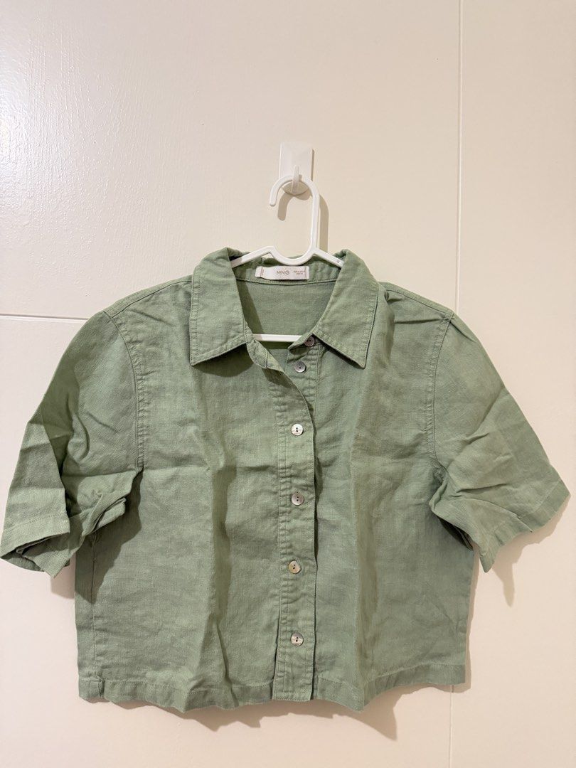 MNG Green Short Sleeve Collared Shirt Size M (Category: Shirts) located in Pasay City. Submitted by triciasclosetph (Listing ID 1470067112, Image 1). Description: - Brand: MNG - Color: Sage Green - Size: Medium (fits EUR, USA, MEX Medium) - Style: Short sleeve, button-up, collared neckline, cropped length - Material: Soft woven texture - Condition: Great basic piece for casual wear or layering - Origin: Made in Bangladesh.