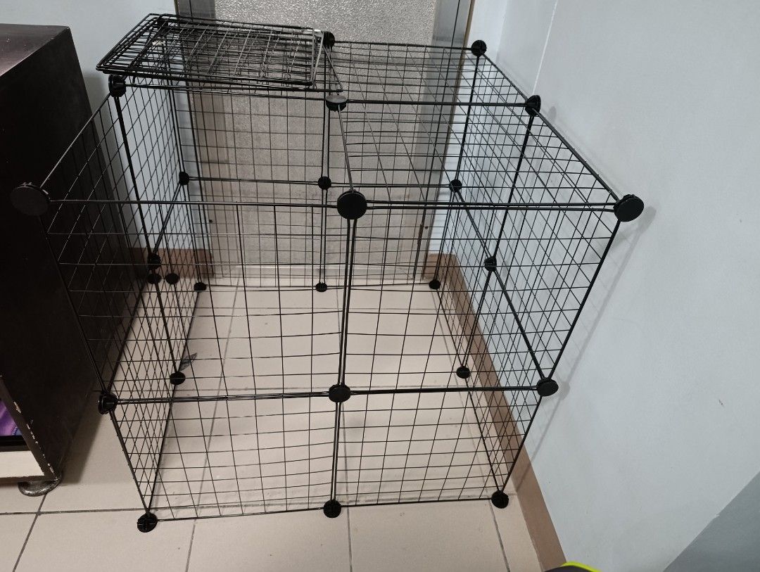 Modular pet cage /playpen (Category: Storage Boxes & Baskets) located in Quezon City. Submitted by gdbye_things (Listing ID 1470010871, Image 1). Description: - Modular wire grid panels with black connectors -24 panels + connectors - Sturdy and durable metal construction - Disassembled for easy transport and storage best for cats, puppies, small animals .