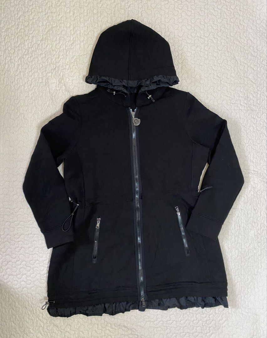 Moncler Black Zip Hoodie with Ruffled Hem (Category: Coats, Jackets and Outerwear) located in Manila. Submitted by refit_thrifts_ (Listing ID 1469985992, Image 1). Description: - Brand: Moncler - Color: Classic Black - Style: Hooded zip jacket with chic ruffle trim along the hood and bottom hem - Hardware: Branded metal zipper pull - Pockets: Two secure zipped lower pockets - Details: Adjustable hood drawstrings and comfortable ribbed cuffs - Fla
