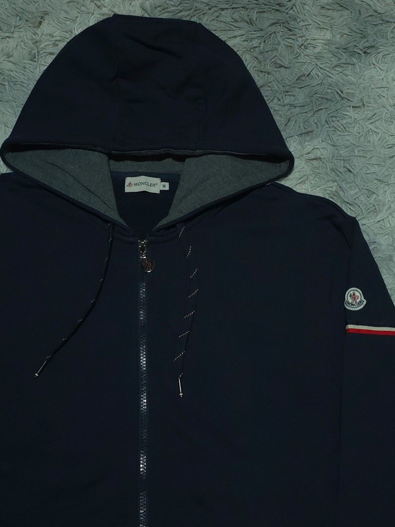 Moncler Navy Blue Zip-up Hoodie (Category: Hoodies) located in Abulug. Submitted by humanwhosellthings (Listing ID 1469988593, Image 2). Description: Size Medium on tag fit to Large 21W x 27L Excellent Condition No issue.
