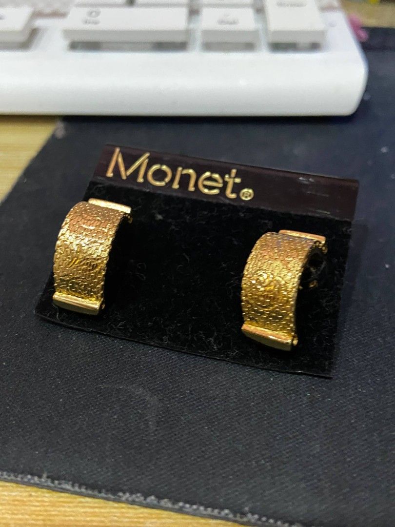 Monet Gold Textured Half Hoop Earrings (Category: Earrings) located in Makati City. Submitted by mistyriver_09 (Listing ID 1470083305, Image 1). Description: - Brand: Authentic vintage Monet - Design: Elegant textured half-hoop with post back closure - Packaging: Includes original black Monet branded backing card - Versatility: Classic piece that easily matches any daily outfit - Condition: Great vintage condition.