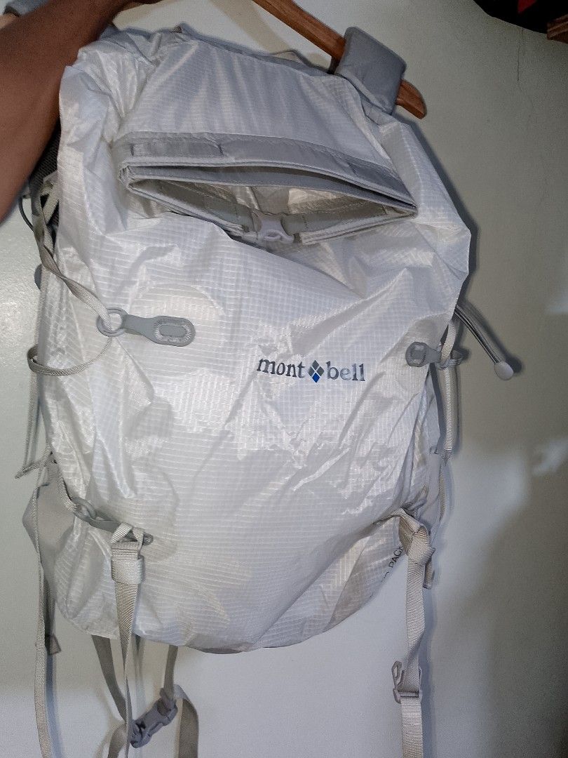 Montbell Altiplano Pack 30 Backpack (Category: Backpacks) located in Manila. Submitted by mjthrifted_second (Listing ID 1469986110, Image 1). Description: - Brand: Montbell - Model: Altiplano Pack 30 - Color: White ripstop fabric - Condition: Clean, hardly any signs of wear - Features: Lightweight design, roll-top with buckle closure, shoulder strap pockets, mesh back panel, and interior zip compartment - Exterior: Multiple adjustment straps and 
