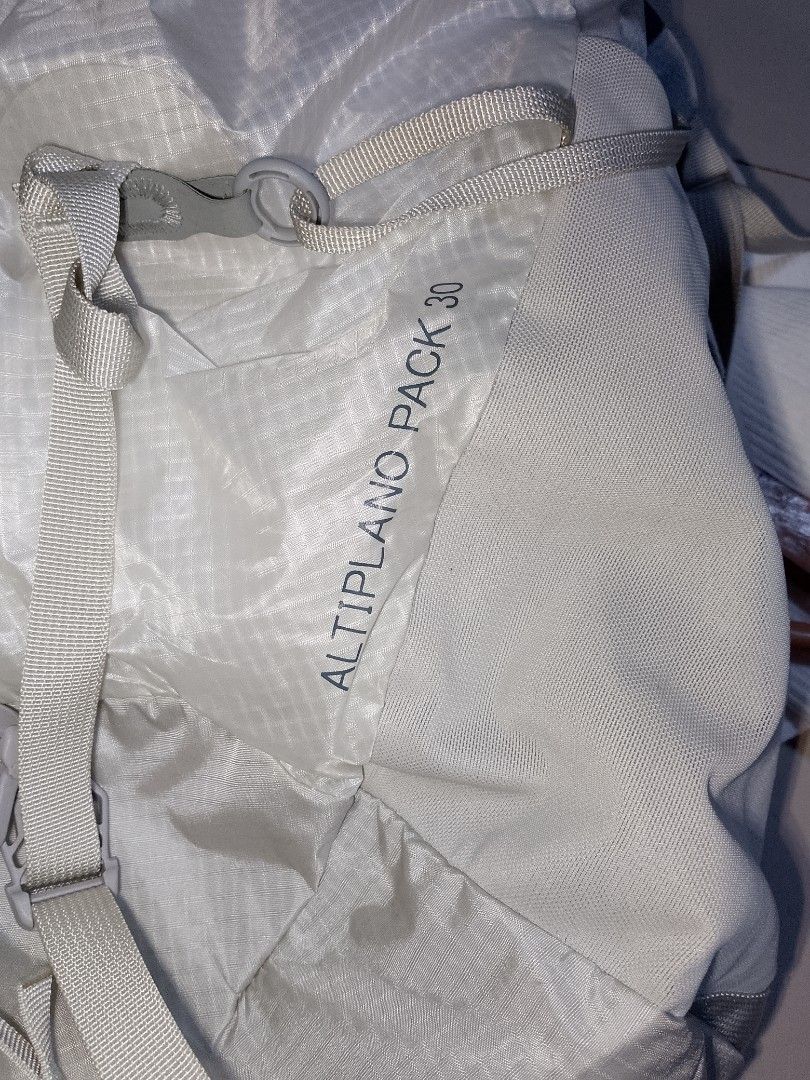 Montbell Altiplano Pack 30 Backpack (Category: Backpacks) located in Manila. Submitted by mjthrifted_second (Listing ID 1469986110, Image 3). Description: - Brand: Montbell - Model: Altiplano Pack 30 - Color: White ripstop fabric - Condition: Clean, hardly any signs of wear - Features: Lightweight design, roll-top with buckle closure, shoulder strap pockets, mesh back panel, and interior zip compartment - Exterior: Multiple adjustment straps and 