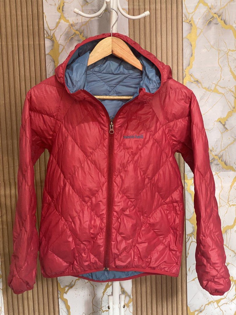 Mont-bell Reversible Down Hooded Jacket Red Blue (Category: Coats, Jackets and Outerwear) located in Baguio. Submitted by rayrai33 (Listing ID 1469974063, Image 3). Description: - Brand: Mont-bell -size:140 9/10 years old - Style: Reversible down jacket with hood - Colors: Vibrant red on one side, light blue on the other - Design: Diamond quilting pattern throughout, zip-up front, and branded logo embroidery on the chest - Features: Lightweight, 