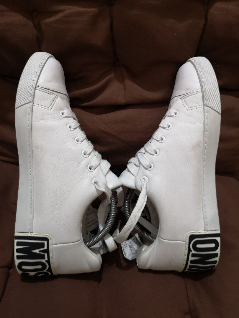 Moschino Maxi Logo White Leather Sneakers (Category: Sneakers) located in Manila. Submitted by lorenzomar99185 (Listing ID 1470018086, Image 3). Description: - Brand: Moschino - Color: Crisp White with Bold Black Logo - Style: Low-top, lace-up street style sneaker - Details: Eye-catching black lettering logo on the back rubber sole - Condition: Clean and ready for daily rotation - Size: EU 44 on tag / Best fit US 10.5 ~ 11.