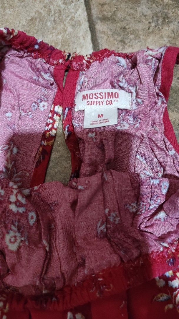 Mossimo Supply Co. Red Floral Print Romper Size M (Category: Rompers) located in Mangatarem. Submitted by itsumo_kokoro (Listing ID 1469976923, Image 3). Description: - Brand: Mossimo Supply Co. - Size: Medium (tag attached) - Design: Red with all-over floral and paisley pattern, plus border print hem - Features: Sleeveless with thin straps, elastic waist with drawstring and tassel details - Material: Lightweight fabric, ideal for sunny days and 