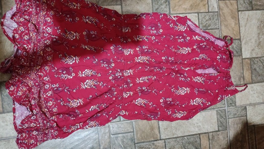 Mossimo Supply Co. Red Floral Print Romper Size M (Category: Rompers) located in Mangatarem. Submitted by itsumo_kokoro (Listing ID 1469976923, Image 2). Description: - Brand: Mossimo Supply Co. - Size: Medium (tag attached) - Design: Red with all-over floral and paisley pattern, plus border print hem - Features: Sleeveless with thin straps, elastic waist with drawstring and tassel details - Material: Lightweight fabric, ideal for sunny days and 