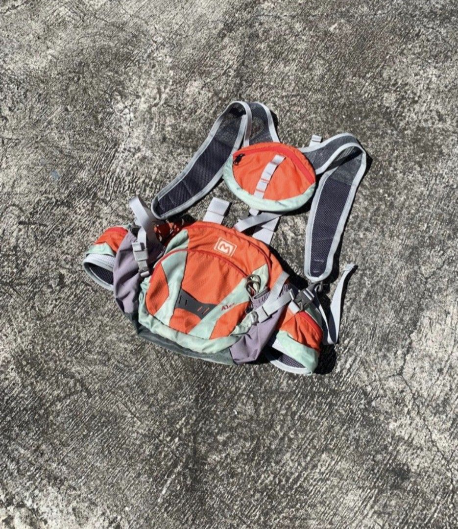 Mountaim Hiking Backpack Daypack (Category: Backpacks) located in San Fernando. Submitted by pearlys3lls (Listing ID 1470108994, Image 1). Description: - Brand/Model: Mountia Hiking Backpack - Color: Bright Orange and Grey - Comfort: Mesh padded back panel for superior breathability - Organization: Multiple zippered compartments and front pouches - Fit: Adjustable harness straps with quick-release buckles - Ideal for: Day hikes, outdoor excursion