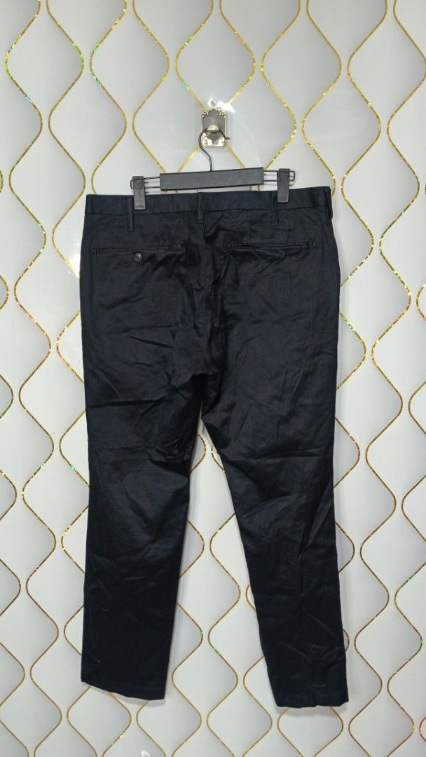 Muji Black Casual Pants (Category: Trousers) located in Manila. Submitted by zariyah.1986 (Listing ID 1469964545, Image 2). Description: - Brand/Style: Muji Black Casual Pants - Material: 98% cotton, 2% spandex (with stretch) - Size: (85cm inseam)(34×38) - Features: Standard button closure, zip fly, and functional back pockets - Condition/Design: Solid black basic, versatile for work or daily casual wear.