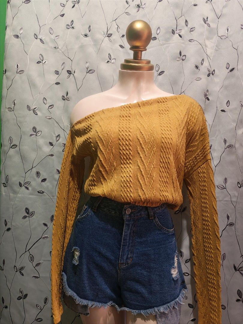 Mustard Yellow Off-Shoulder Cable Knit Sweater (Category: Longsleeves) located in Caloocan City. Submitted by _misskaye (Listing ID 1470044563, Image 2). Description: Small to Medium frame - Color: Mustard yellow - Style: Cable knit sweater with off-shoulder neckline and long sleeves - Texture: Textured pattern throughout the body and sleeves - Fabric: Cozy and comfortable, great for cooler weather or layering - Styling Tip: Pairs perfectly with 