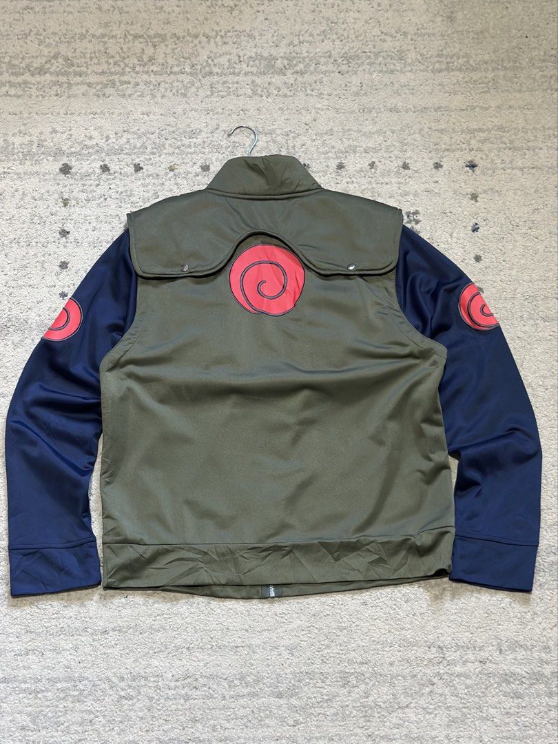 Naruto Shippuden Kakashi Hatake Full-Zip Jacket Size L (Category: Coats, Jackets and Outerwear) located in Daet. Submitted by thrifthings2018 (Listing ID 1470037215, Image 2). Description: - Official Naruto Shippuden merchandise - Kakashi Hatake inspired design with green vest and dark blue sleeves - Features iconic Uzumaki swirl symbols on the back and shoulders - Full zip front closure with functional chest pockets - Size: L (Measures 23" acros