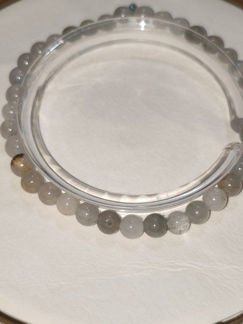 Natural Blue Rabbit Hair Quartz (Category: Bracelets) located in Caloocan City. Submitted by books_and_beads (Listing ID 1470107223, Image 1). Description: - Apperance: clear-to-smoky quartz base with very fine, needle-like blue/black inclusions (the "hair") inside the beads. - Size: 6mm beads ✨ Benefits & Associations: · Clarity & Focus: Rutilated quartz is a strong energizer that helps clear mental fog and promotes clarity of thought. · Manifes