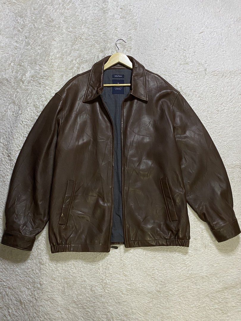Nautica 2000s Brown Leather Bomber Jacket (Category: Coats, Jackets and Outerwear) located in Cavite. Submitted by nld_thrift (Listing ID 1470081169, Image 1). Description: Nautica 2000s Brown Leather Bomber Jacket W27 L 31.5 Size 48 on tag 9.3 condition 9.5 Color rate made in china Flaw: Repaired issue EXTERIOR: 100% GENUINE LEATHER LINING: BODY - 100% COTTON SLEEVES: 100% POLYESTER PROFESSIONAL DRY CLEANING ONLY No refund/ no return, ask before