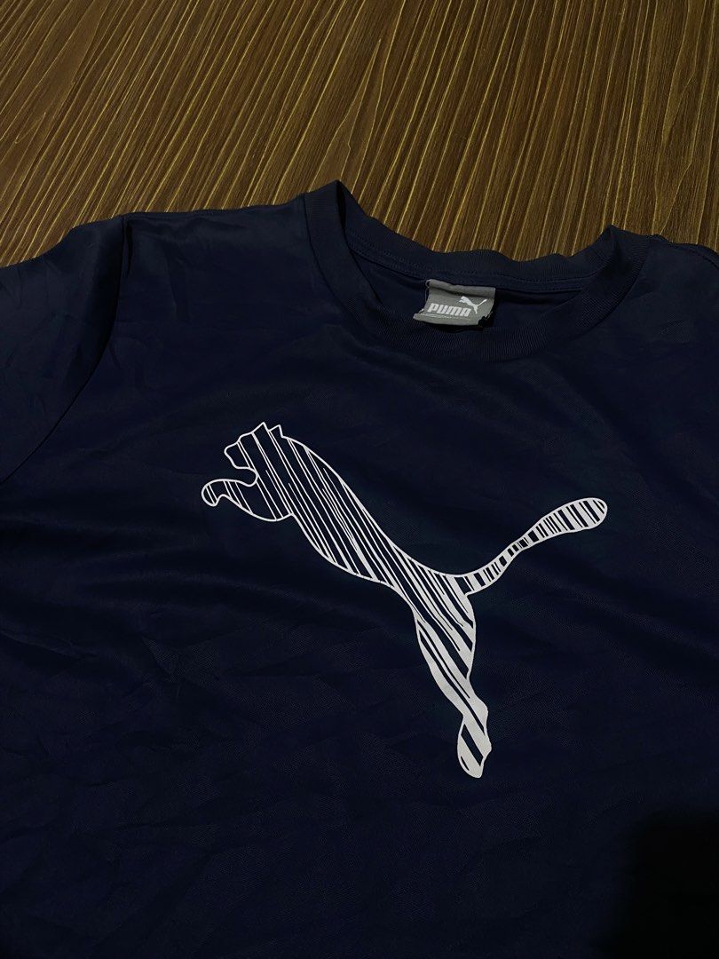 Navy Blue Puma Men's Cat Logo Tee (Category: Activewear) located in Bansalan. Submitted by cjs_thrift (Listing ID 1470081016, Image 2). Description: - MEDIUM - DIMENSIONS: 20.5 by 25 - COLOR RATE:9.5/10 - VERY GOOD CONDITION - NO ISSUE - CUT WASH TAG - NEED WASH.