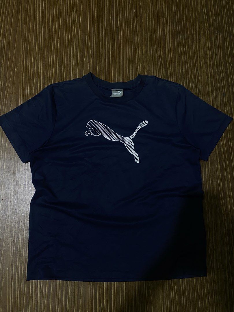 Navy Blue Puma Men's Cat Logo Tee (Category: Activewear) located in Bansalan. Submitted by cjs_thrift (Listing ID 1470081016, Image 1). Description: - MEDIUM - DIMENSIONS: 20.5 by 25 - COLOR RATE:9.5/10 - VERY GOOD CONDITION - NO ISSUE - CUT WASH TAG - NEED WASH.