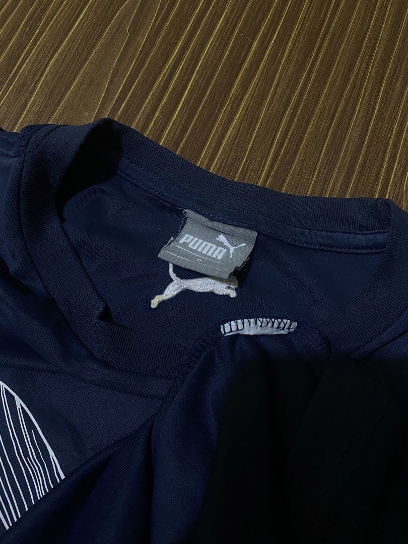 Navy Blue Puma Men's Cat Logo Tee (Category: Activewear) located in Bansalan. Submitted by cjs_thrift (Listing ID 1470081016, Image 3). Description: - MEDIUM - DIMENSIONS: 20.5 by 25 - COLOR RATE:9.5/10 - VERY GOOD CONDITION - NO ISSUE - CUT WASH TAG - NEED WASH.