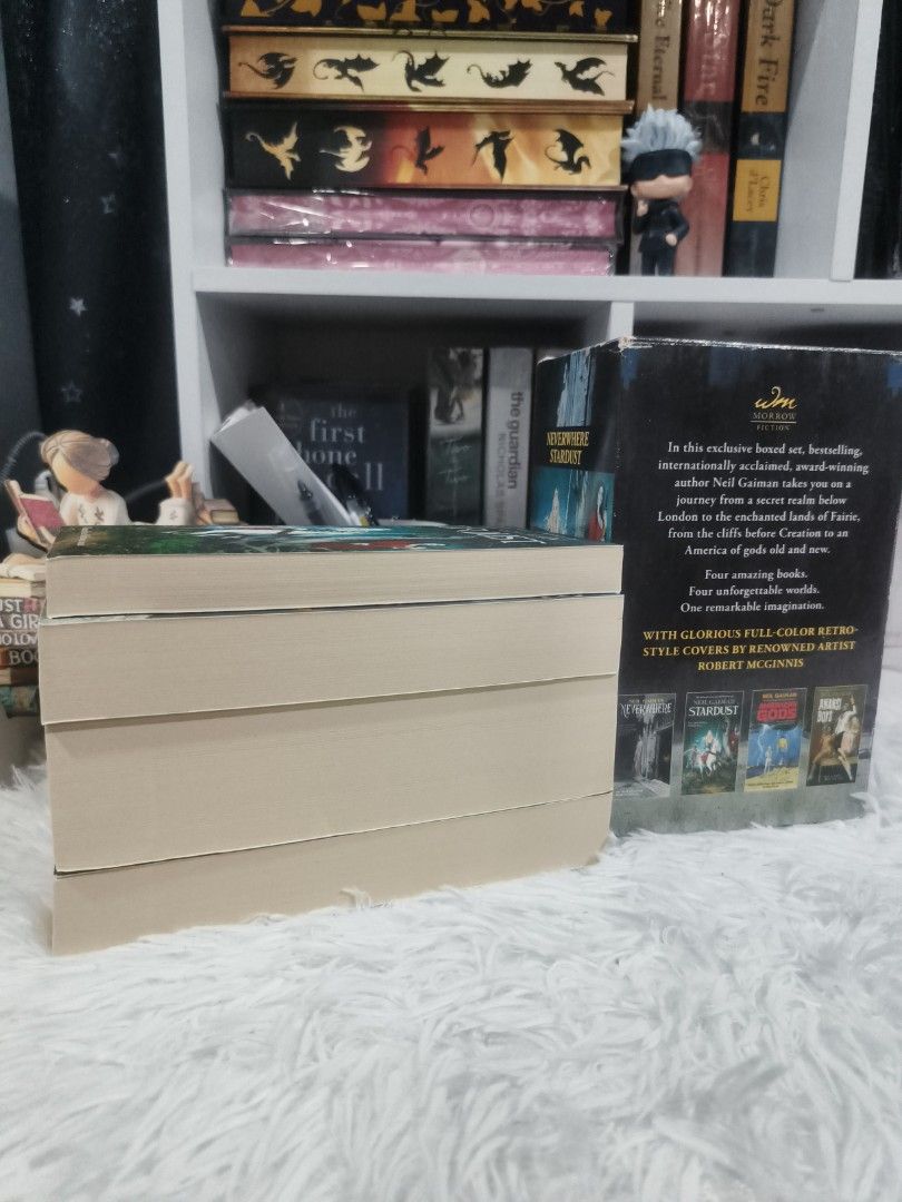 Neil Gaiman 4-Book Box Set Morrow Fiction (Category: Storybooks) located in Cabuyao City. Submitted by chaptersandwonders143 (Listing ID 1469995838, Image 3). Description: - Complete 4-book Neil Gaiman paperback box set: Neverwhere, Stardust, American Gods, and Anansi Boys - Stunning retro-style full-color covers by renowned artist Robert McGinnis - Includes original illustrated slipcase box - Book condition: Clean pages and uncreased spines (lik