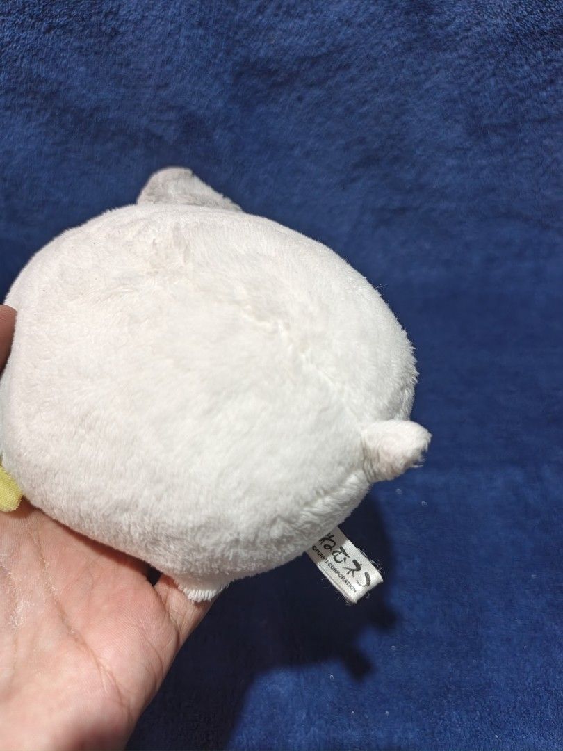 Nemu Nemu Cat Plush Toy (Category: Plushies & Soft Toys) located in Manila. Submitted by kirstentoyshub (Listing ID 1470137124, Image 2). Description: - Brand: FuRyu (Nemu Nemu series) - Design: Sleepy white cat with pink cheeks and a yellow ribbon - Size: Palm-sized - Condition: Clean, fluffy, and brand new with tag attached - Perfect for gifts or collection!.