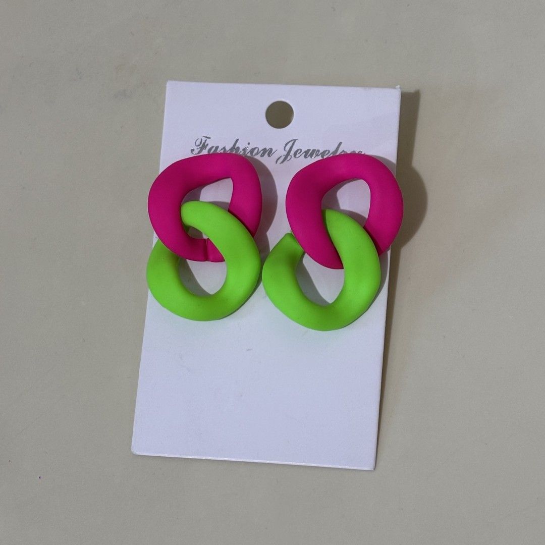Neon Pink and Green Chain Link Dangle Earrings (Category: Earrings) located in Quezon City. Submitted by slvrbullet (Listing ID 1470139171, Image 1). Description: - Style: Bold neon pink and green interlocking links - Material: Matte finish plastic/acrylic - Condition: Brand new, unworn, comes on original display card - Occasion: Perfect for parties or adding a pop of color to everyday outfits.