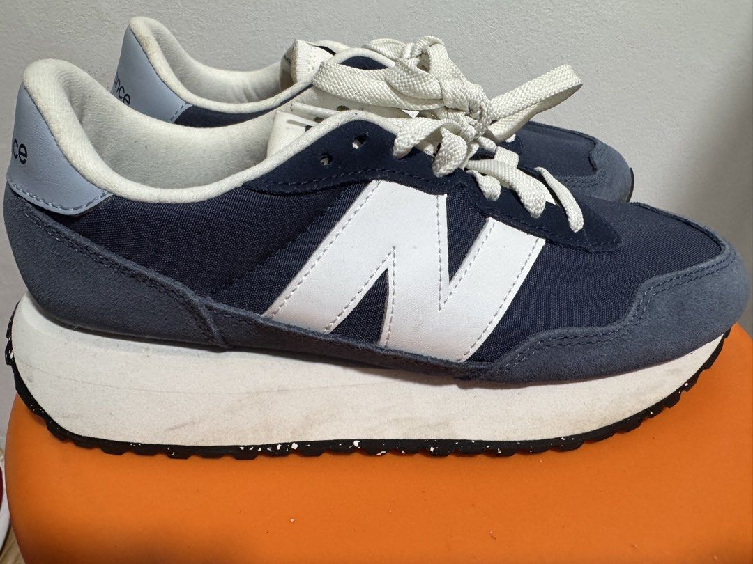 New Balance 237 Navy White Sneakers (Category: Sneakers) located in Valenzuela. Submitted by sofiasticated.decluttering (Listing ID 1470004880, Image 3). Description: - Brand/Model: New Balance 237 - Color: Navy blue and white with light blue accents - Material: Premium suede and canvas upper - Sole: Thick white cushioned midsole with speckled black rubber outsole - Style: Casual vintage runner, low-top design - Condition: Lightly used, well-main